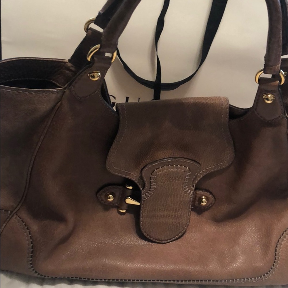 Authentic Gucci handbag in light tan leather.